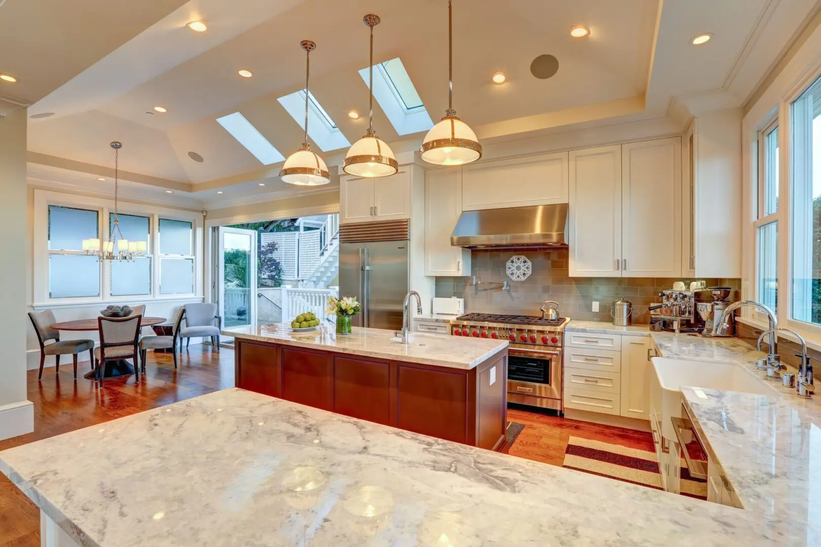 A kitchen with a large island and lots of counter space.
