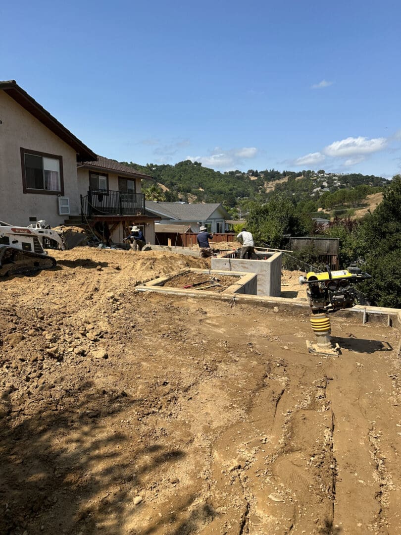 A house that is being built on the side of a hill.