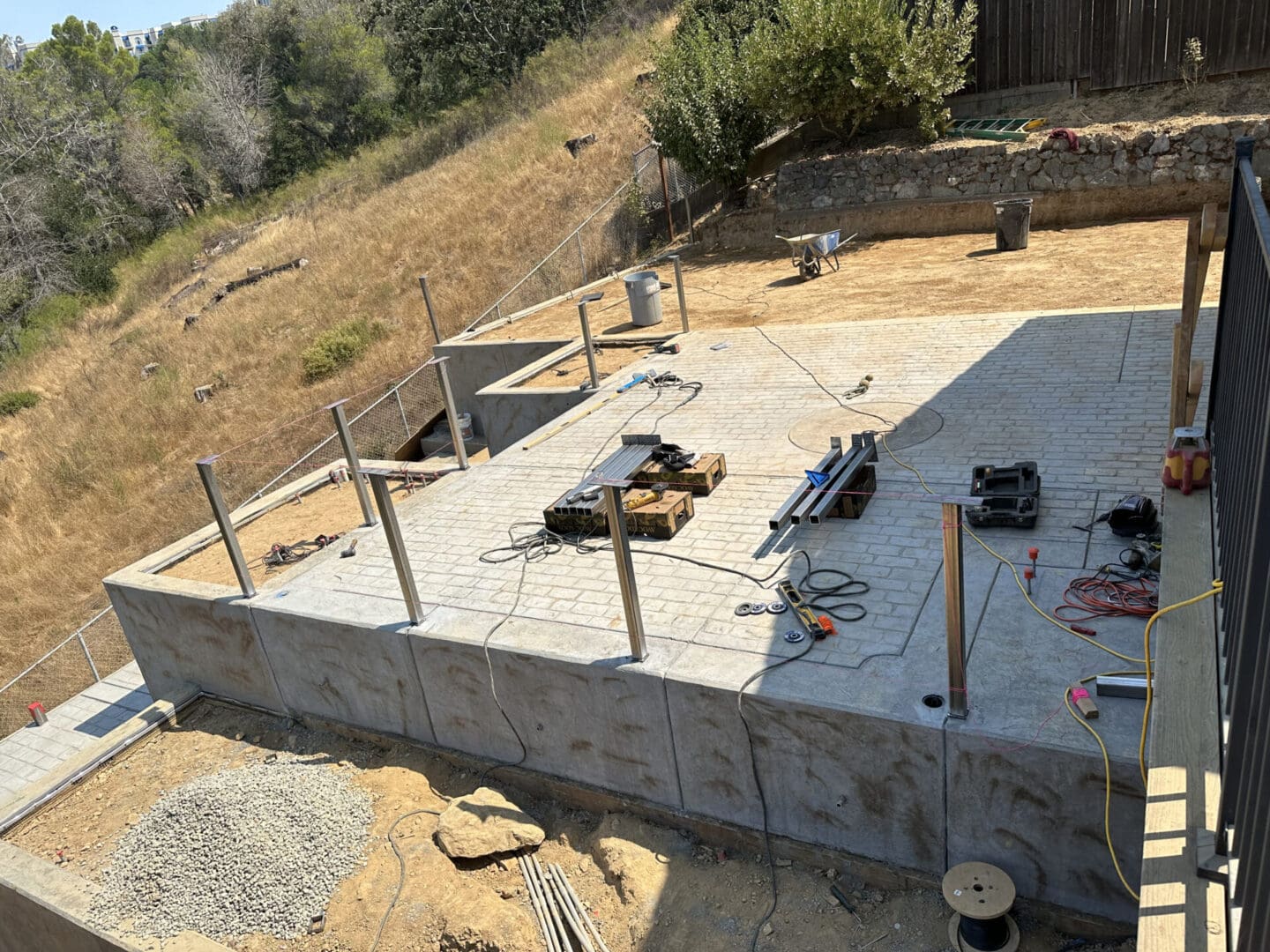 A concrete slab being built on top of the hillside.