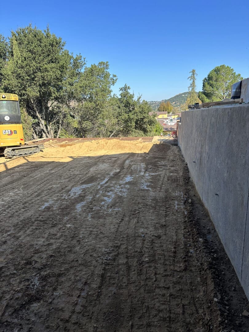 A construction vehicle is parked on the side of a road.