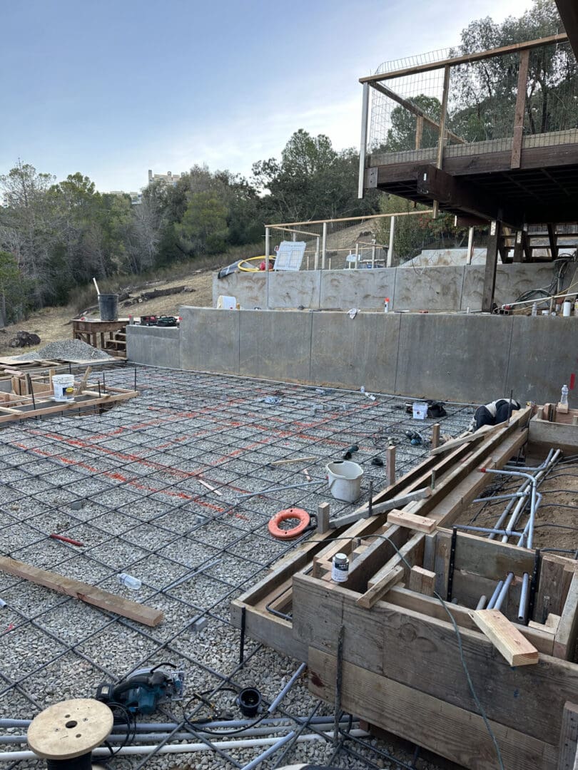 A view of construction site with concrete slab being poured.