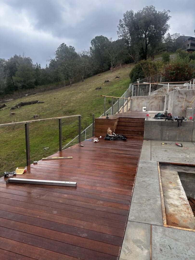 A deck being built with wood and glass