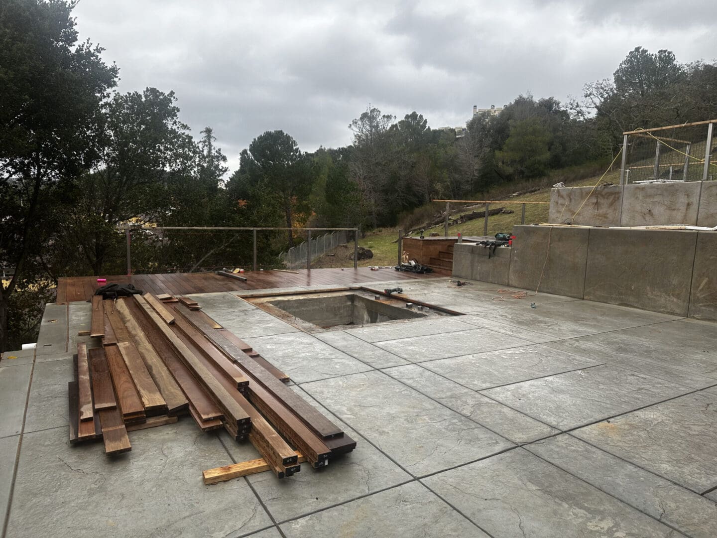 A pool is being built in the middle of a patio.