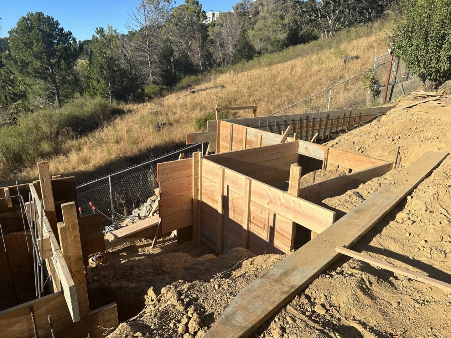 A wooden structure that is being built on top of the ground.